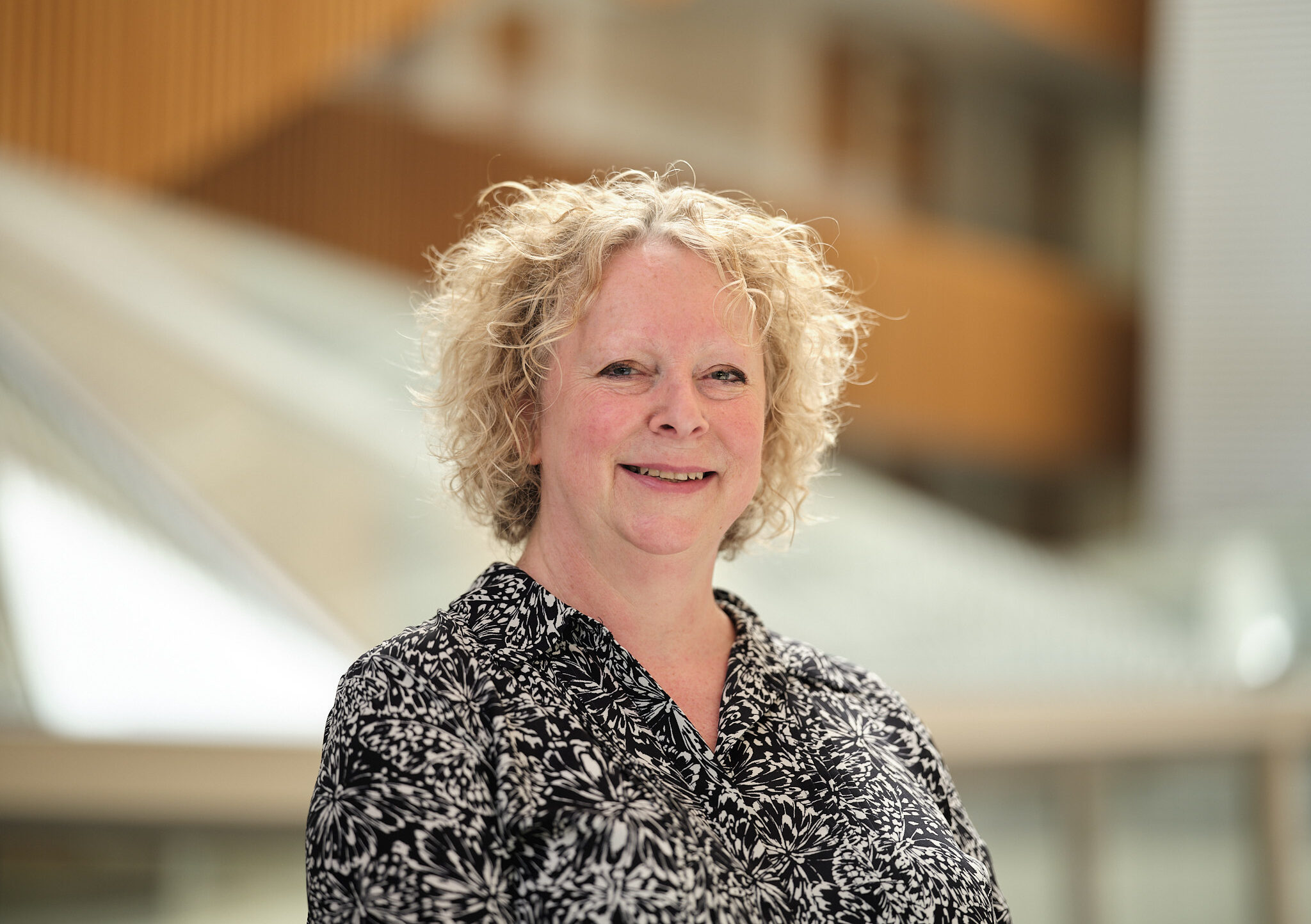 Dr Alison MacDonald, Interim Director, standing and smiling.
