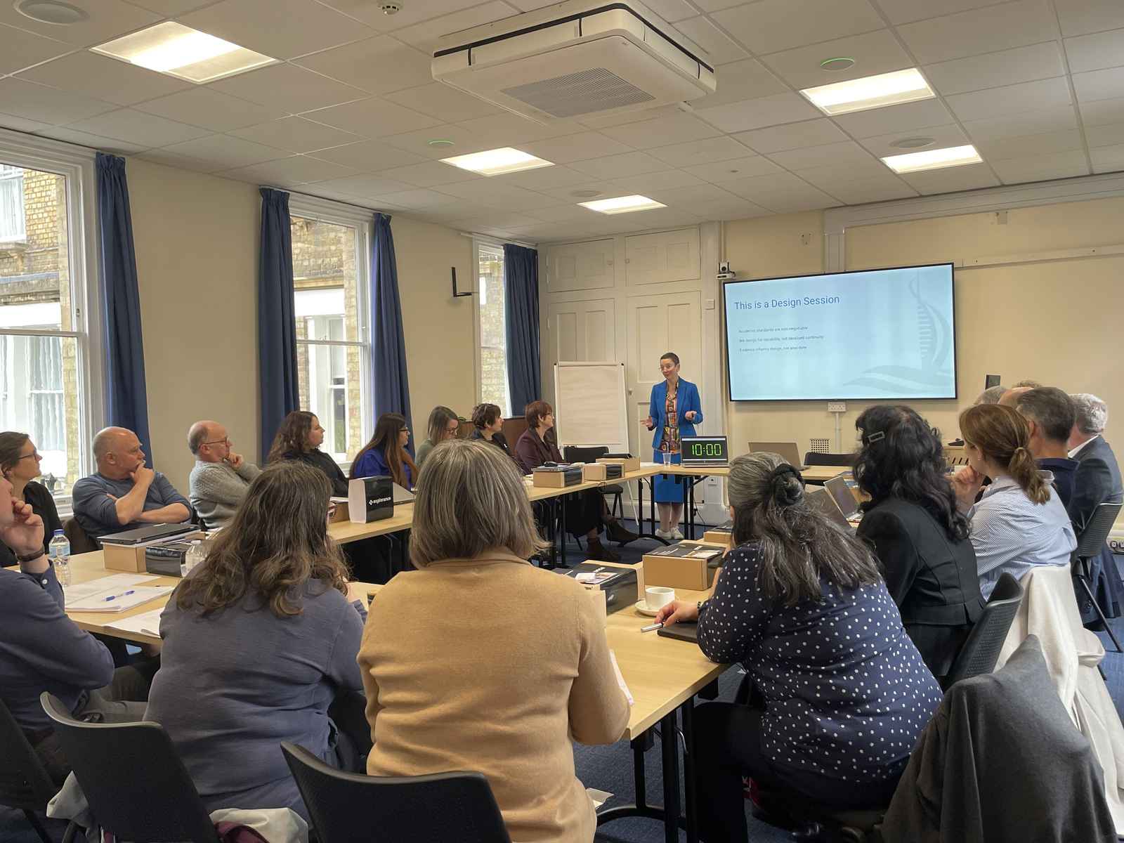 Professor Harriet Dunbar-Morris presenting to room of people in Rewley House, Oxford.
