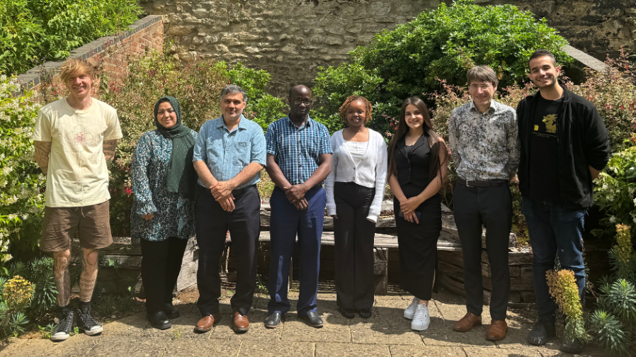 Left to right: Dr Tom Crawford, five students from the core maths course, Dr Ben Grant, and course tutor Behrad Ahmadpour.